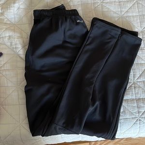 Black Nike sport pants 32-30 with zipper on the side of the legs.
